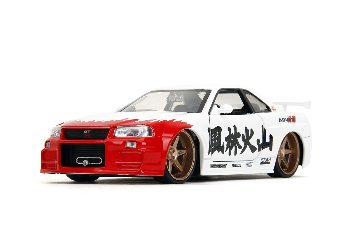 JADA 1:24 Street Fighter – Nissan Skyline GT-R (R34) Con Figurina Ryu – 35114 – Nuovo